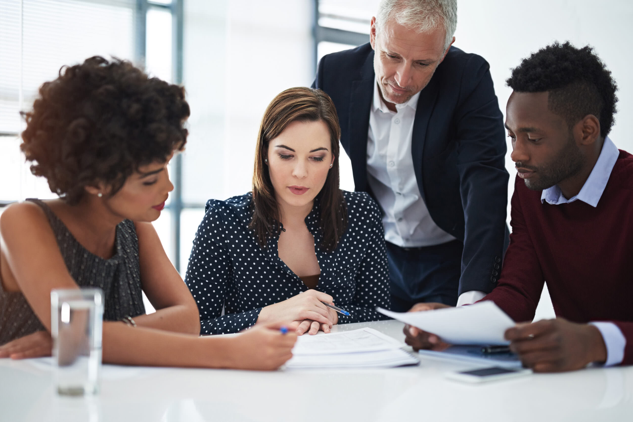 Cropped shot of corporate businesspeople working in the boardroom